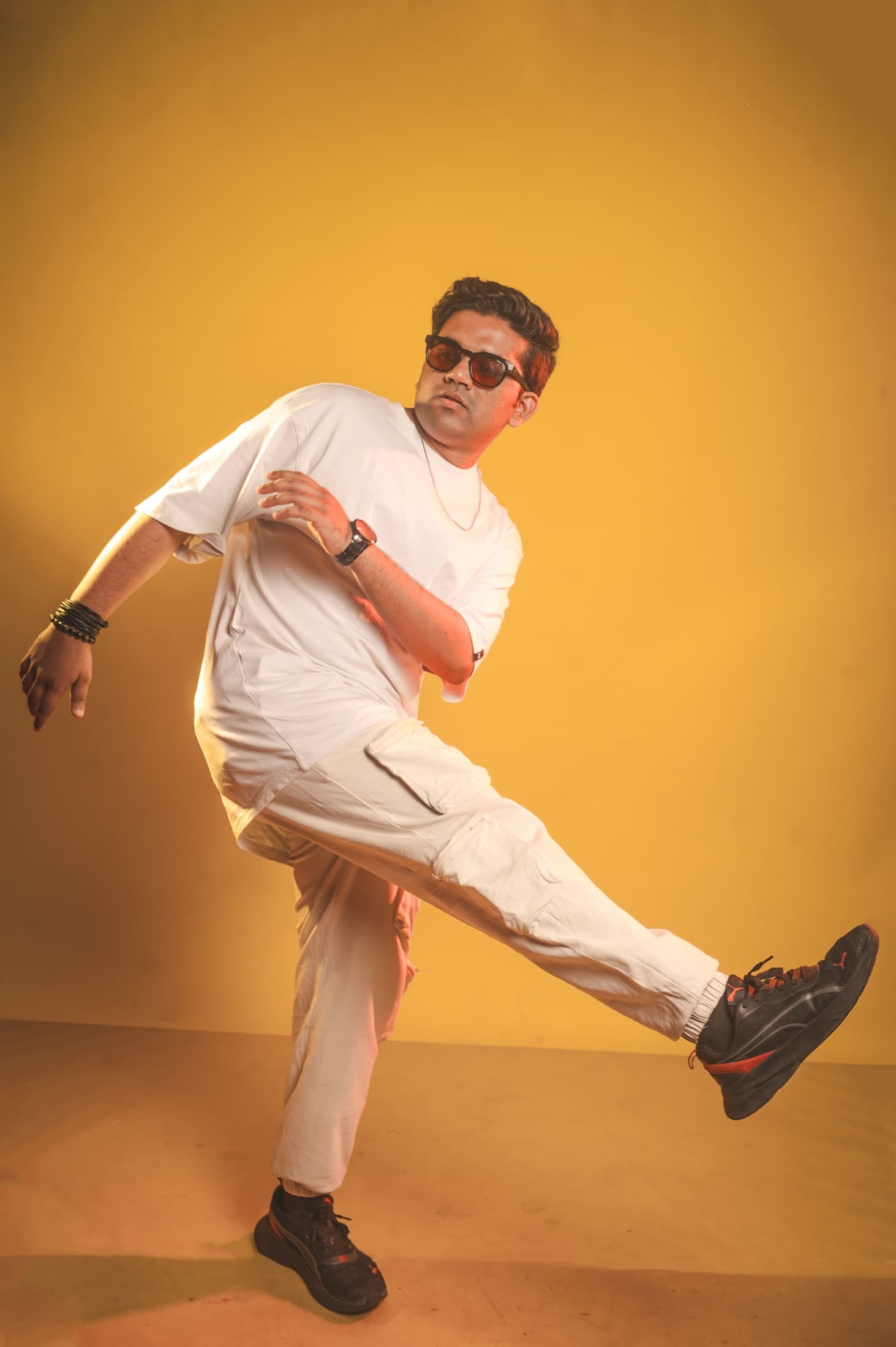 TRE mid-kick against an amber backdrop
